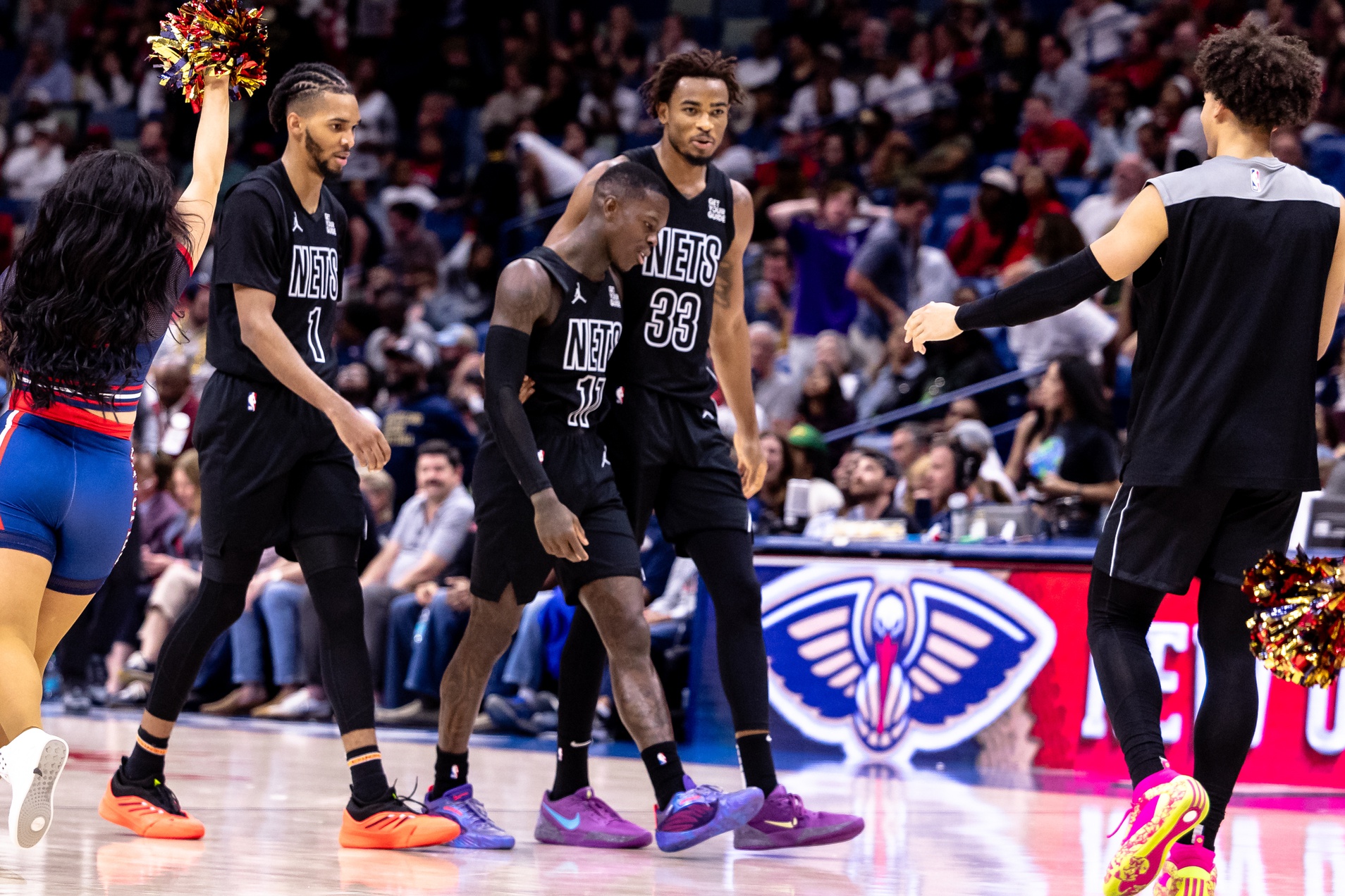 Brooklyn Nets guard Dennis Schroder (17) is congratulated by center Nic Claxton