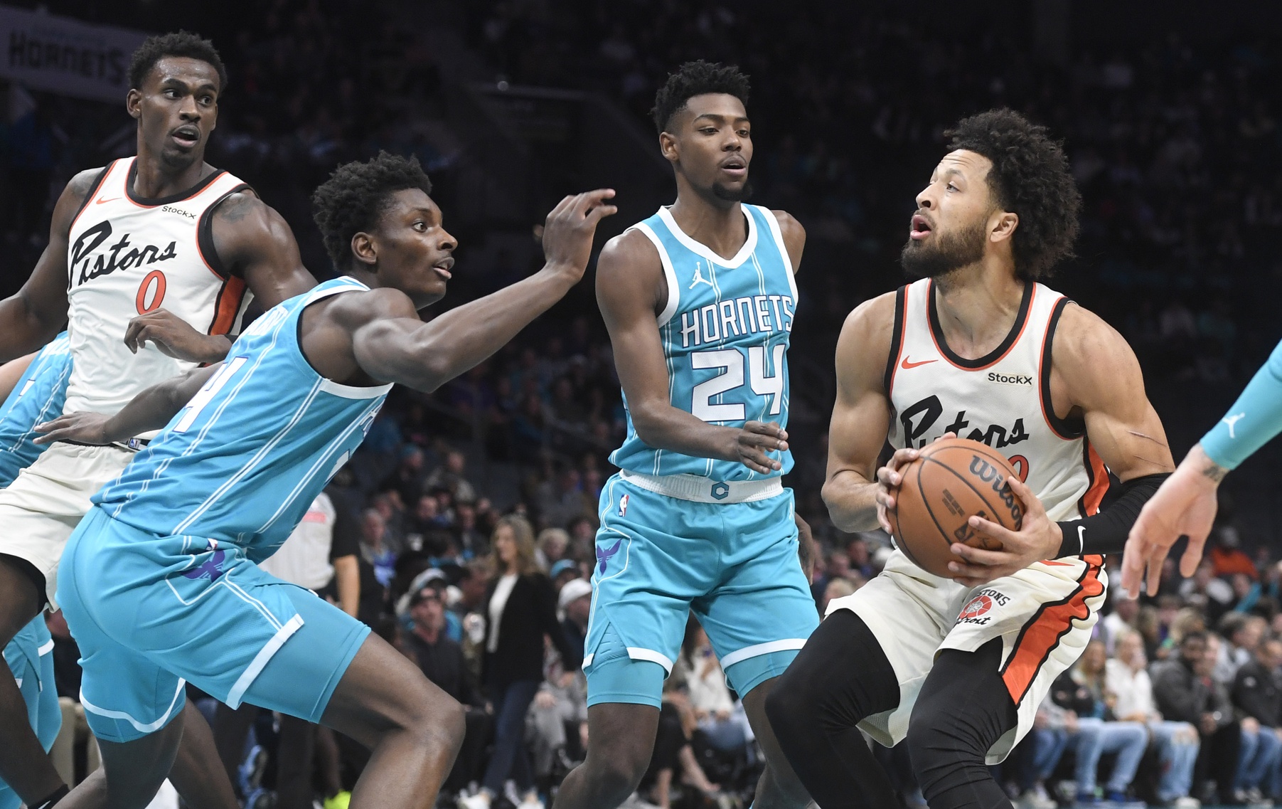 Nov 21, 2024; Charlotte, North Carolina, USA; Detroit Pistons guard Cade Cunningham (2) looks to shoot through the defense of the Charlotte Hornets during the first half at the Spectrum Center. Mandatory Credit: Sam Sharpe-Imagn Images