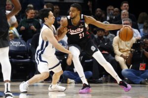 Nov 25, 2024; Memphis, Tennessee, USA; Portland Trail Blazers guard Rayan Rupert (21) dribbles as Memphis Grizzlies guard Yuki Kawamura (17) defends during the second half at FedExForum. Mandatory Credit: Petre Thomas-Imagn Images