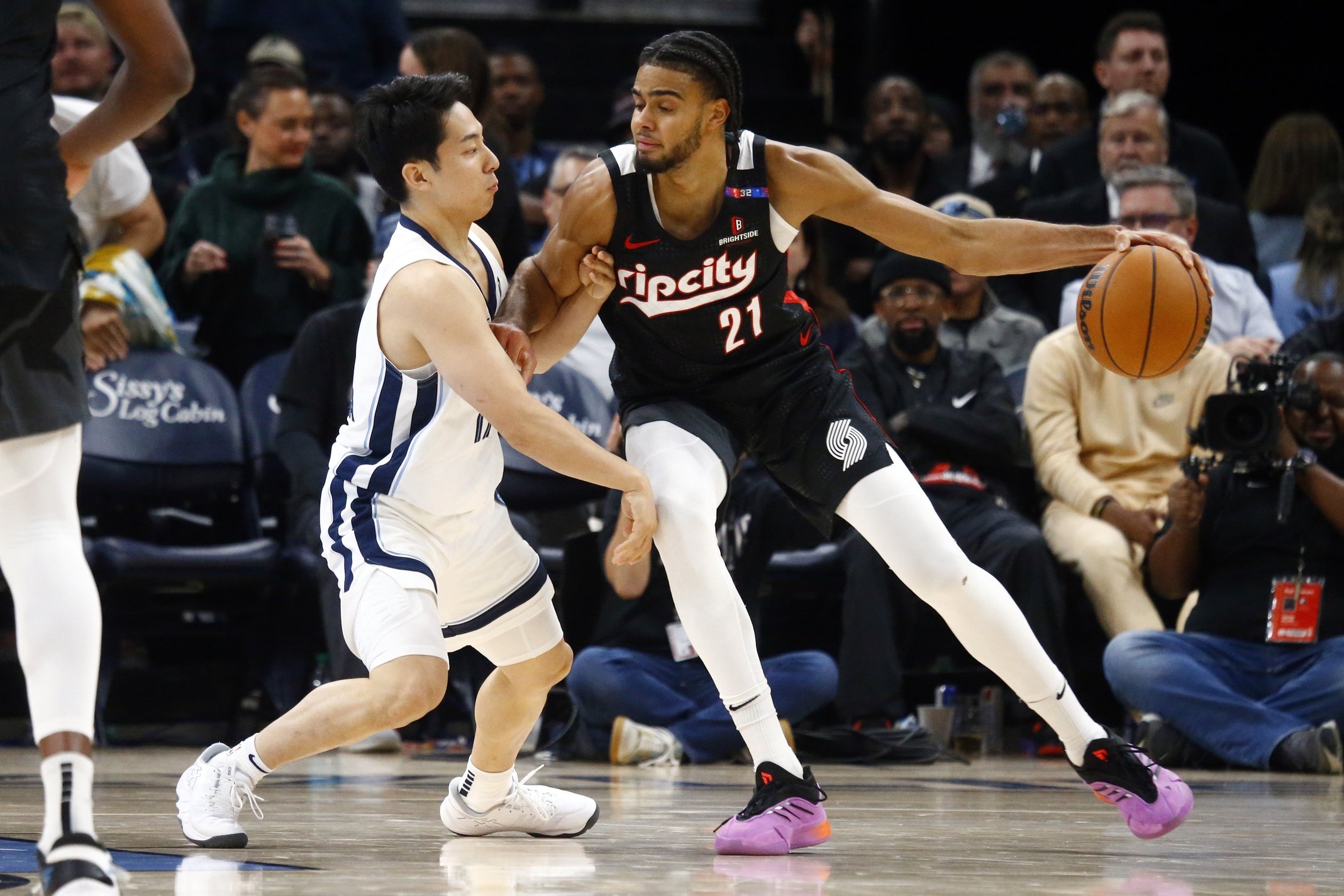 Nov 25, 2024; Memphis, Tennessee, USA; Portland Trail Blazers guard Rayan Rupert (21) dribbles as Memphis Grizzlies guard Yuki Kawamura (17) defends during the second half at FedExForum. Mandatory Credit: Petre Thomas-Imagn Images