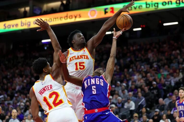 Atlanta Hawks center Clint Capela (15) blocks a shot by Sacramento Kings guard De'Aaron Fox (5)