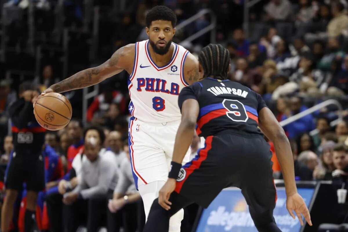 Philadelphia 76ers forward Paul George (8) dribbles defended by Detroit Pistons forward Ausar Thompson (9)