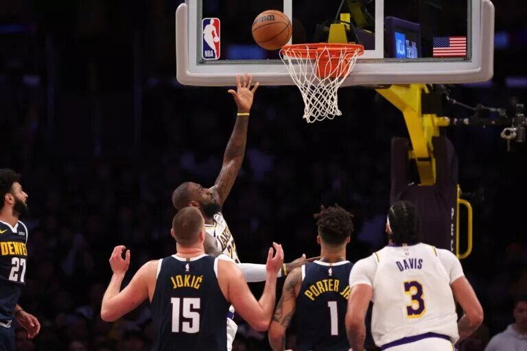 Los Angeles Lakers forward LeBron James (23) goes to the basket during the second quarter against the Denver Nuggets