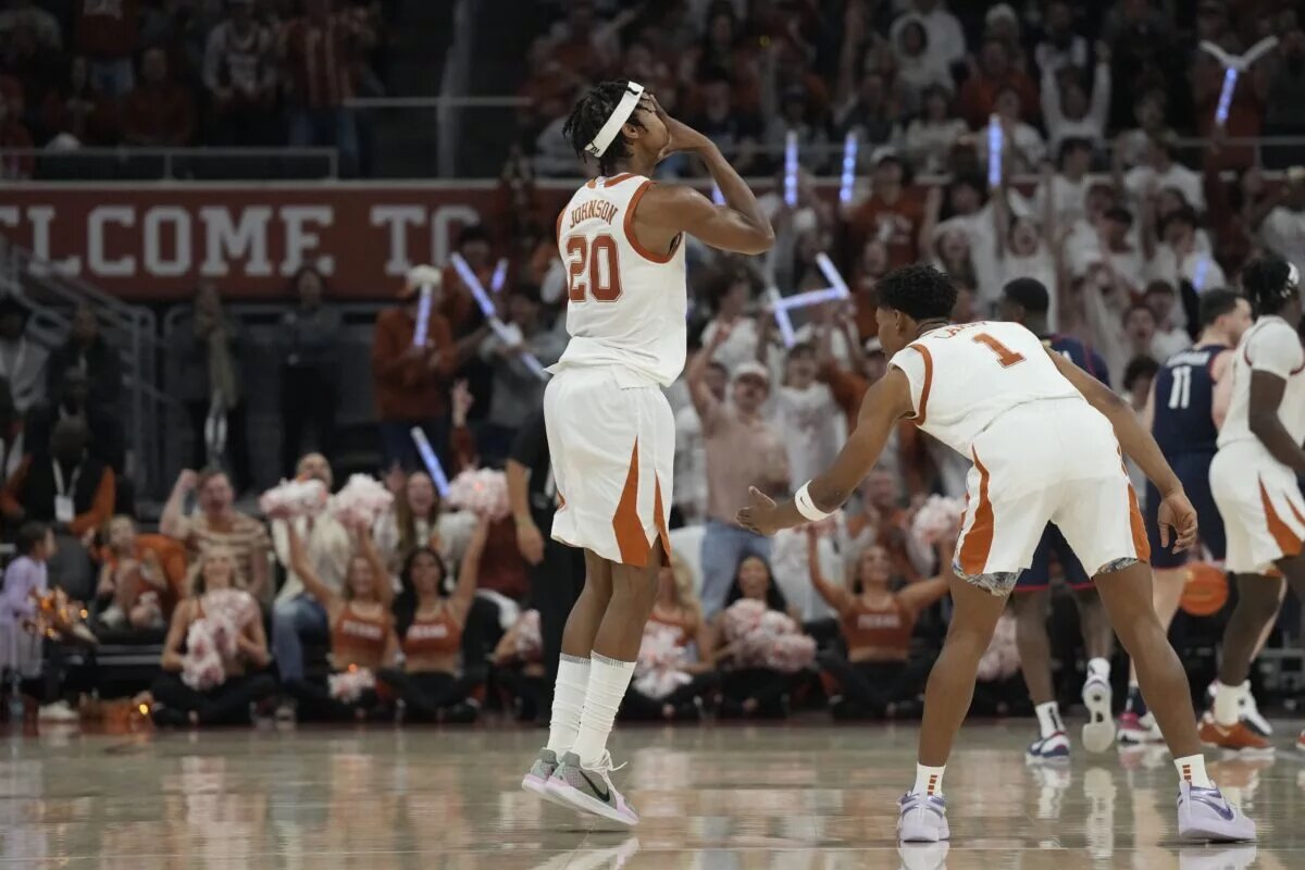 Texas Longhorns guard Tre Johnson (20) reacts after scoring a three point basket