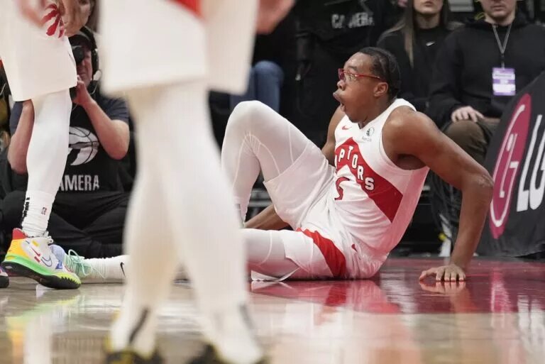 Toronto Raptors forward Scottie Barnes (4) reacts after injury