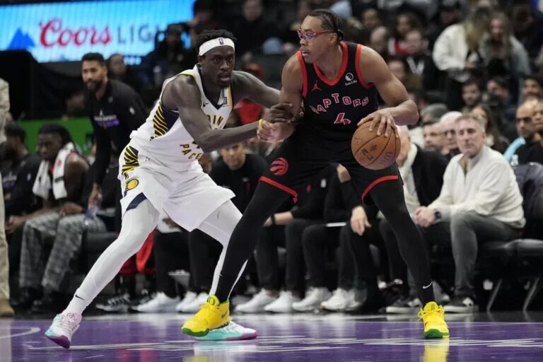 Indiana Pacers forward Pascal Siakam (43) defends against Toronto Raptors forward Scottie Barnes (4)