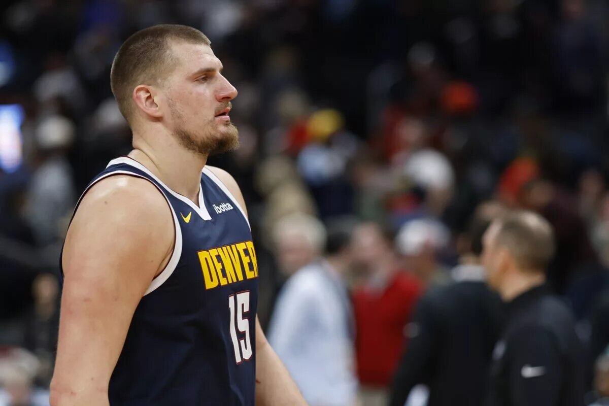 Denver Nuggets center Nikola Jokic (15) walks off the court
