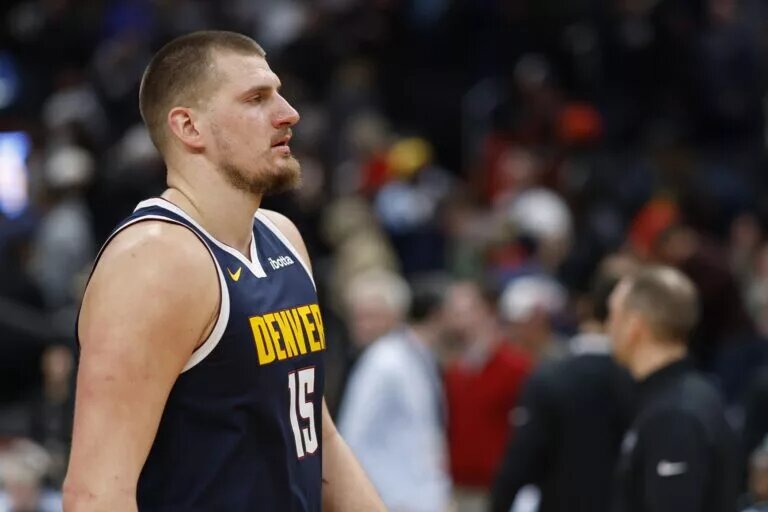 Denver Nuggets center Nikola Jokic (15) walks off the court
