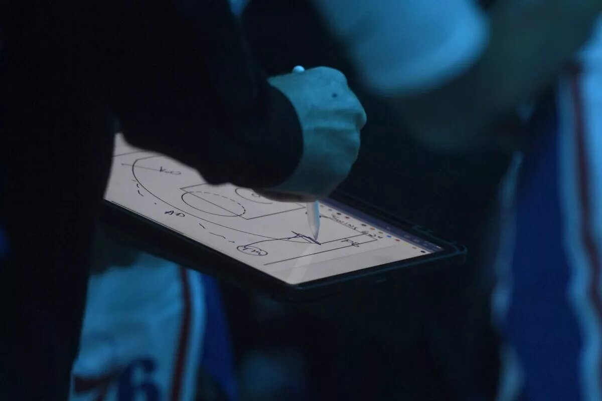 Philadelphia 76ers head coach Nick Nurse draws up a play
