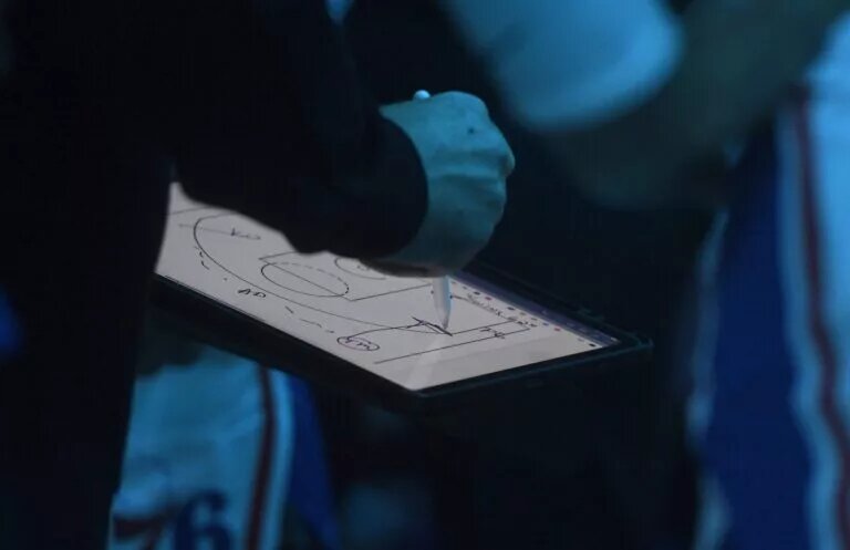 Philadelphia 76ers head coach Nick Nurse draws up a play