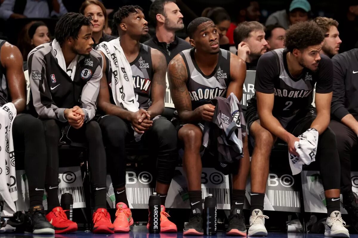 Brooklyn Nets center Nic Claxton (33) and forward Dorian Finney-Smith (28) and guard Shake Milton (7) and forward Cameron Johnson (2) watch from the bench