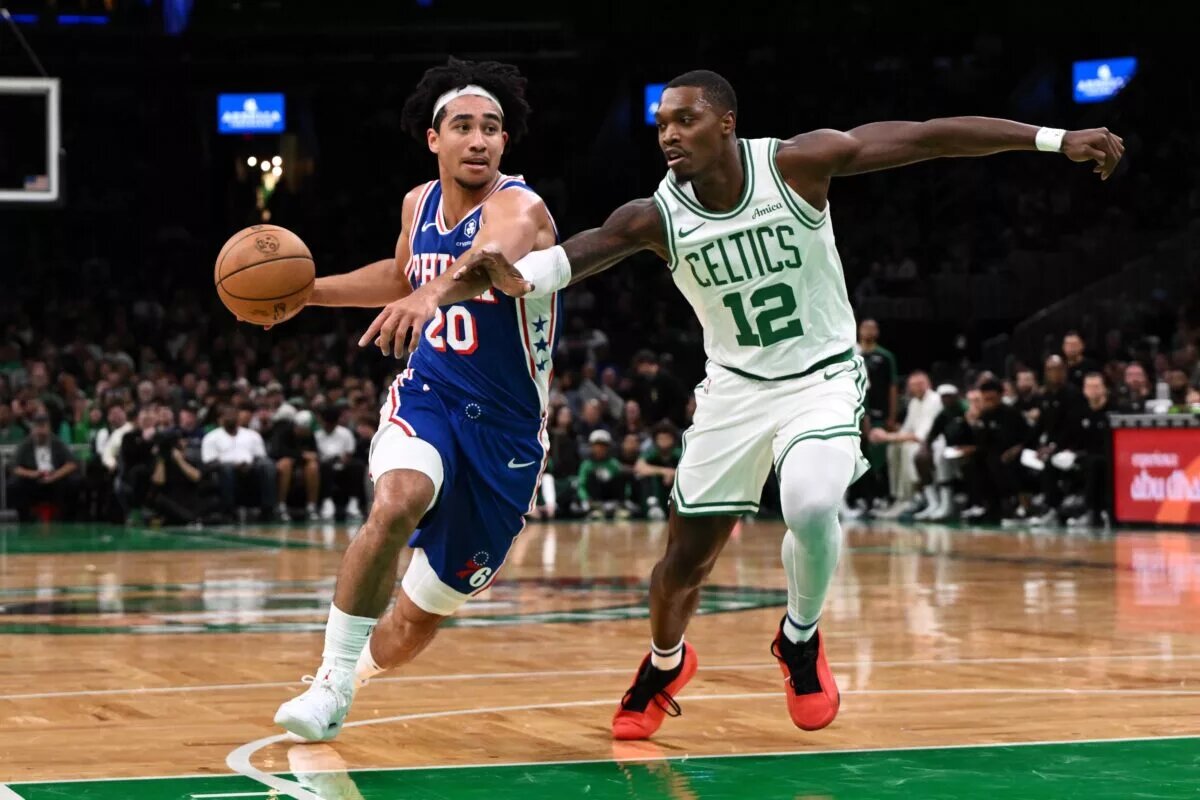 Philadelphia 76ers guard Jared McCain (20) drives to the basket against Boston Celtics guard Lonnie Walker IV (12)