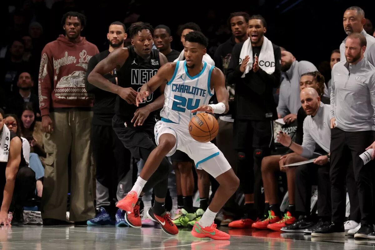 Charlotte Hornets forward Brandon Miller (24) controls the ball against Brooklyn Nets forward Dorian Finney-Smith (28)
