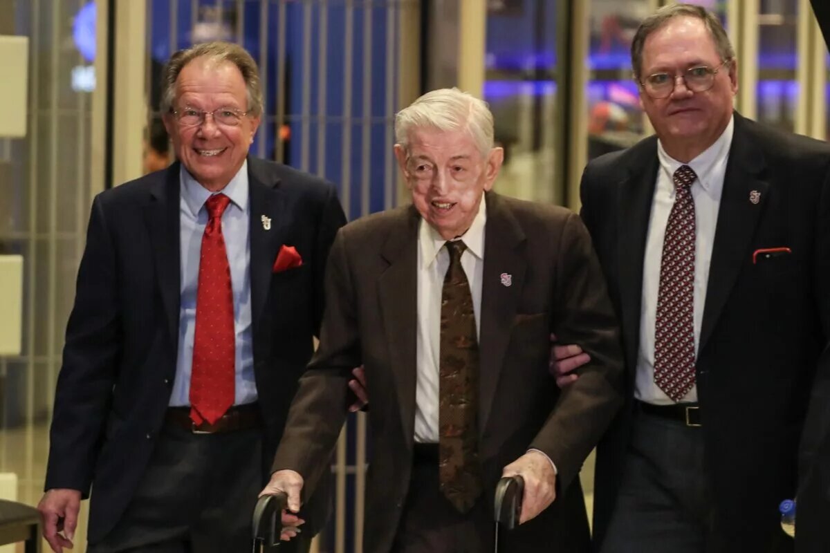 Mar 21, 2023; New York, NY, USA; Former St. John’s head coach Lou Carnesecca (center) is escorted into the introductory press conference for new head coach Rick Pitino at Madison Square Garden. Mandatory Credit: Wendell Cruz-USA TODAY Sports