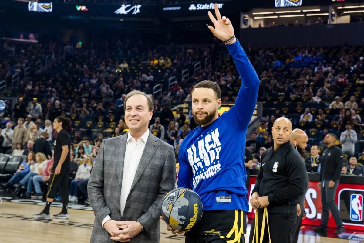 Feb 10, 2024; San Francisco, California, USA; Golden State Warriors CEO Joe Lacob presents guard Stephen Curry (30) with the 2024 NBA All-Star ball before the game against the Phoenix Suns at Chase Center. Mandatory Credit: John Hefti-USA TODAY Sports