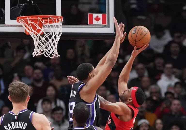Mar 20, 2024; Toronto, Ontario, CAN; Toronto Raptors forward Bruce Brown (11) drives to the basket as Sacramento Kings forward Keegan Murray (13) tries to defend during the first quarter at Scotiabank Arena.