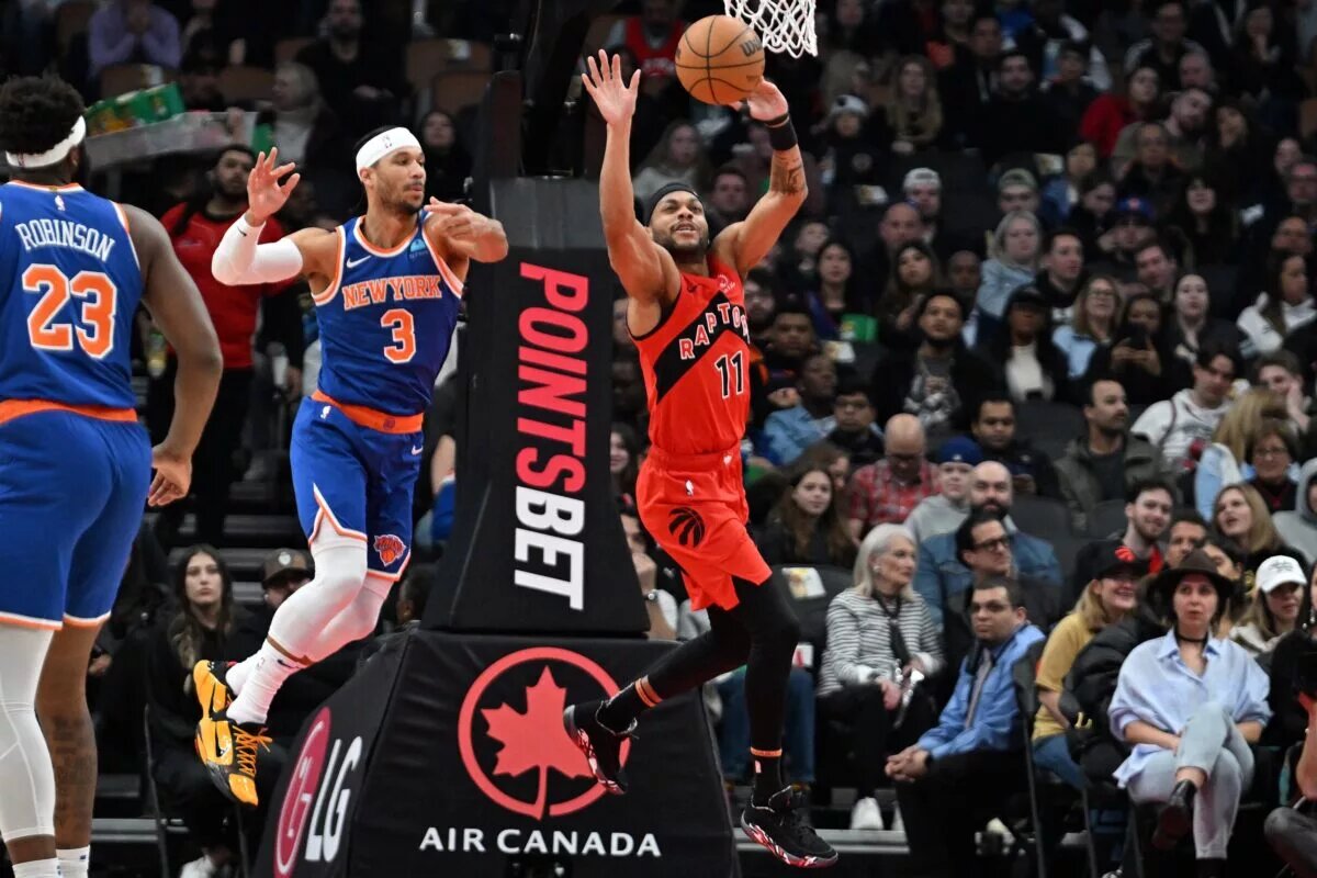 Mar 27, 2024; Toronto, Ontario, CAN; New York Knicks guard Josh Hart (3) breaks up a pass intended for Toronto Raptors guard Bruce Brown (11) in the first half at Scotiabank Arena.