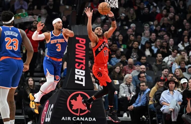 Mar 27, 2024; Toronto, Ontario, CAN; New York Knicks guard Josh Hart (3) breaks up a pass intended for Toronto Raptors guard Bruce Brown (11) in the first half at Scotiabank Arena.