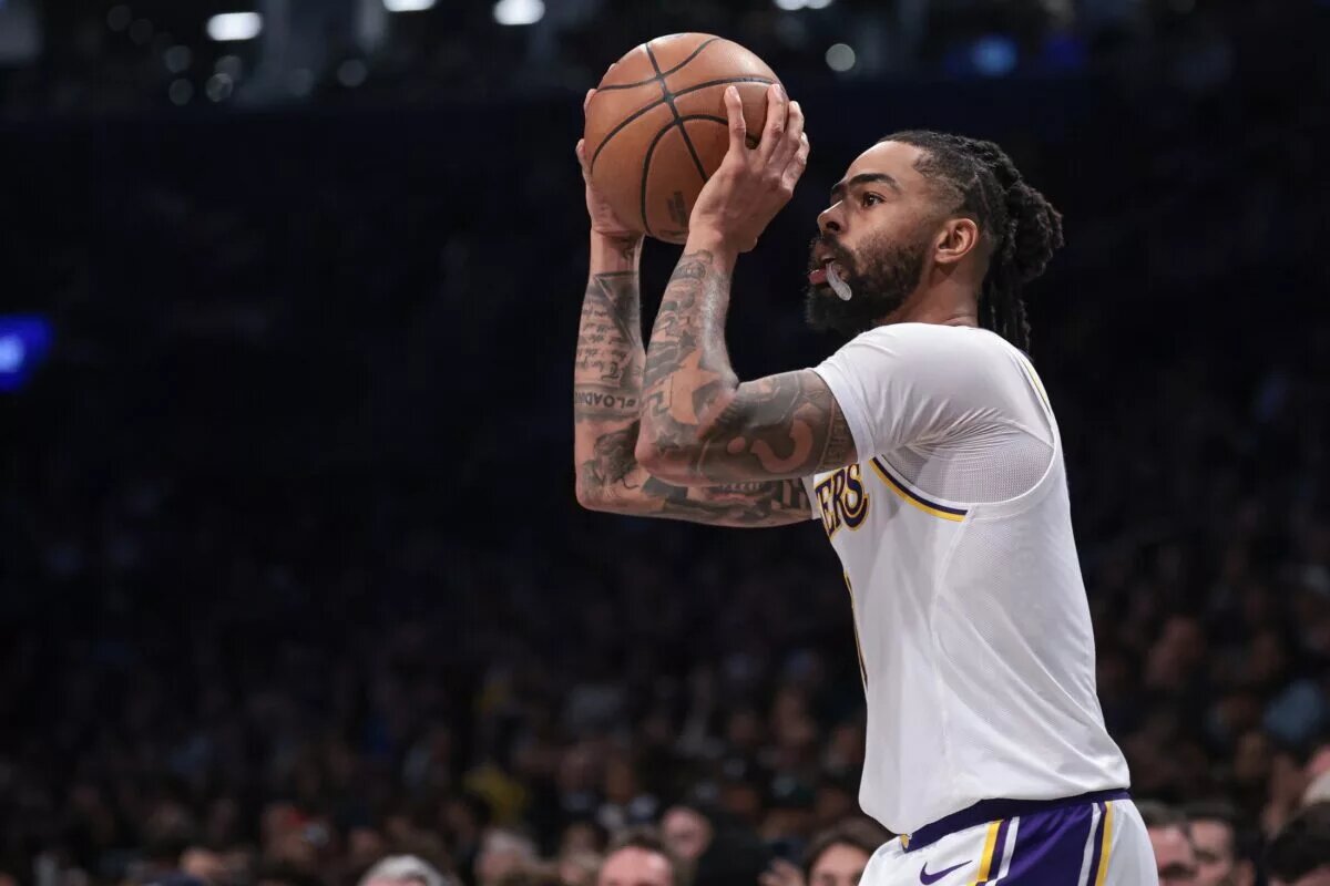 Mar 31, 2024; Brooklyn, New York, USA; Los Angeles Lakers guard D'Angelo Russell (1) shoots during the second half against the Brooklyn Nets at Barclays Center.
