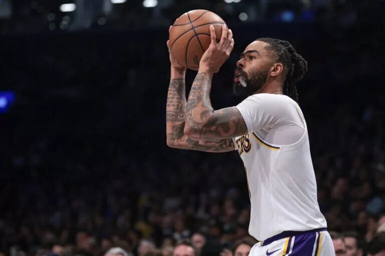 Mar 31, 2024; Brooklyn, New York, USA; Los Angeles Lakers guard D'Angelo Russell (1) shoots during the second half against the Brooklyn Nets at Barclays Center.