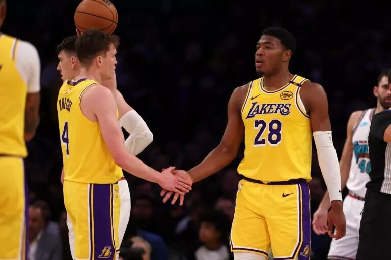 Nov 13, 2024; Los Angeles, California, USA; Los Angeles Lakers forward Rui Hachimura (28) is greeted by guard Dalton Knecht (4) after scoring a basket during the third quarter at Crypto.com Arena. Mandatory Credit: Kiyoshi Mio-Imagn Images