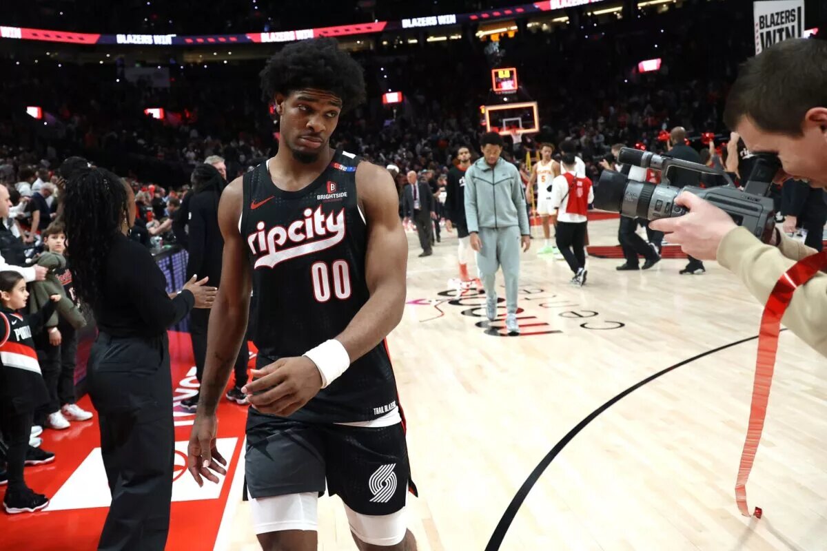 Nov 17, 2024; Portland, Oregon, USA; Portland Trail Blazers guard Scoot Henderson (00) poses for the camera after the Trail Blazers defeat Atlanta Hawks 114-110 in the second half at Moda Center. Mandatory Credit: Jaime Valdez-Imagn Images