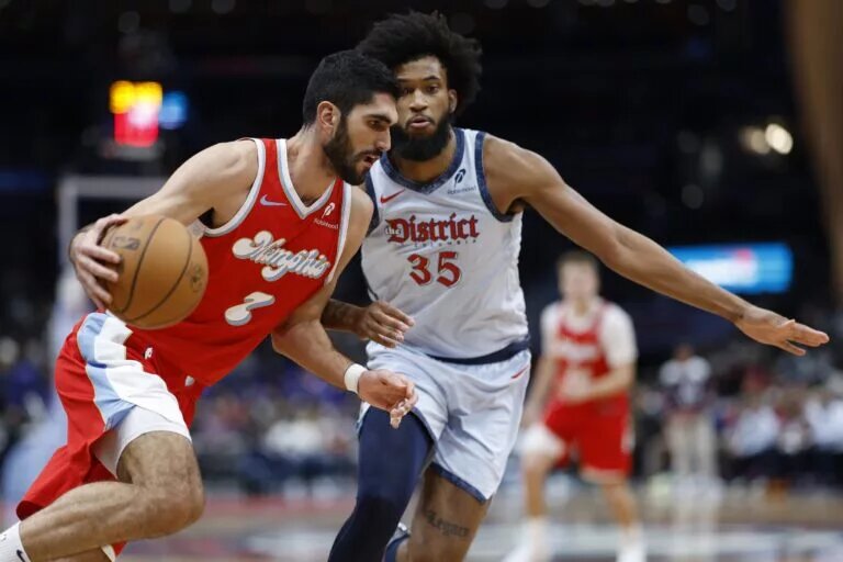 Dec 8, 2024; Washington, District of Columbia, USA; Memphis Grizzlies forward Santi Aldama (7) drives to the basket as Washington Wizards forward Marvin Bagley III (35) defends in the fourth quarter at Capital One Arena. Mandatory Credit: Geoff Burke-Imagn Images