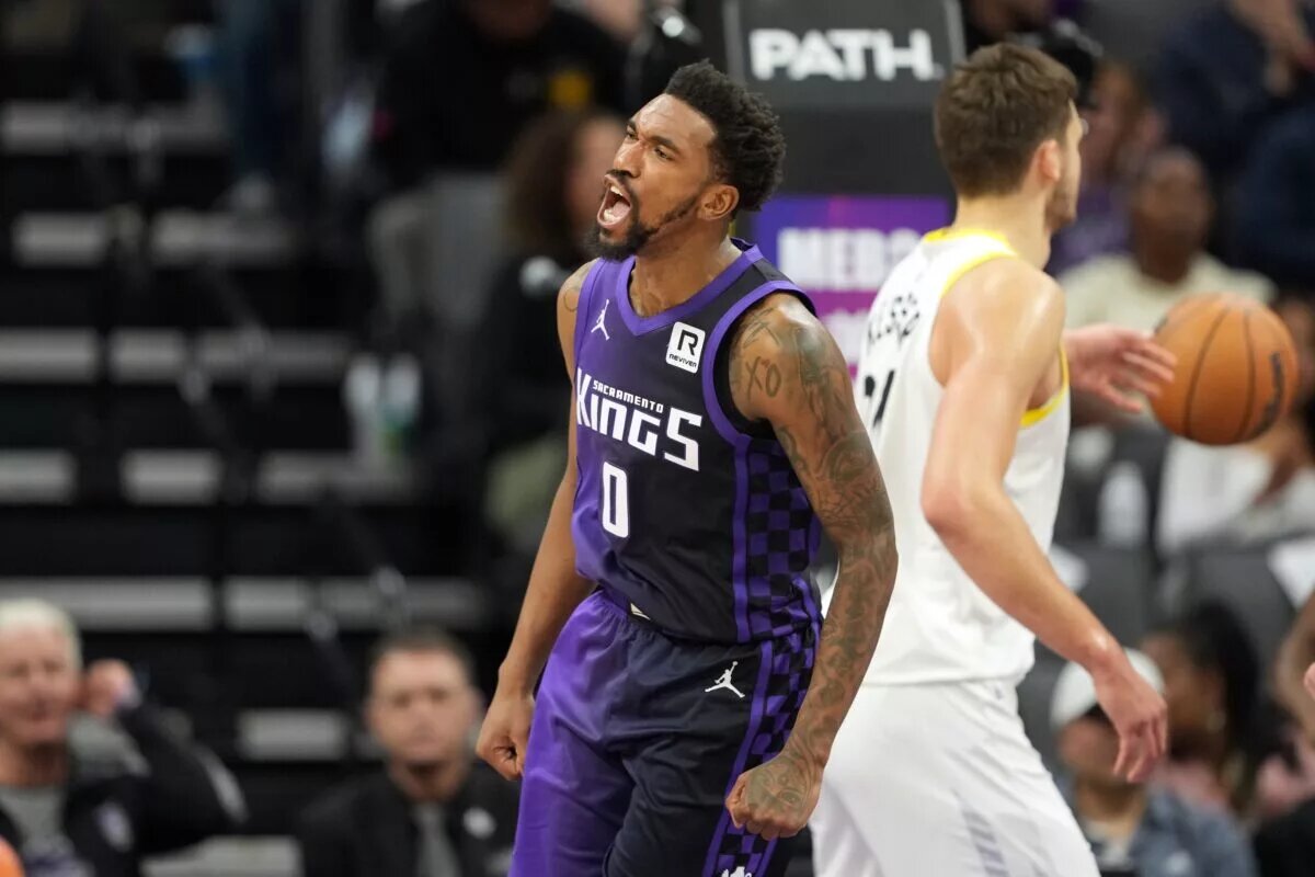 Dec 8, 2024; Sacramento, California, USA; Sacramento Kings guard Malik Monk (0) reacts after scoring against the Utah Jazz during the third quarter at Golden 1 Center. Mandatory Credit: Darren Yamashita-Imagn Images
