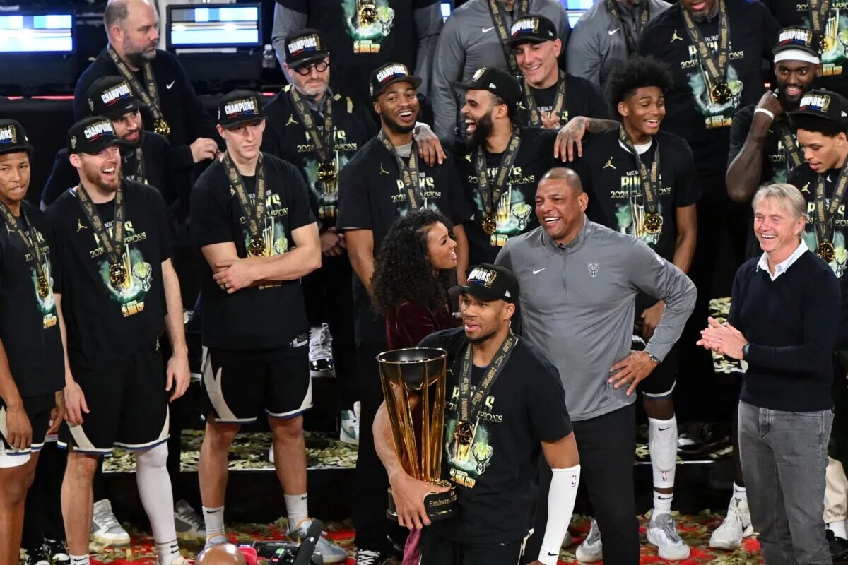 Dec 17, 2024; Las Vegas, Nevada, USA; Milwaukee Bucks forward Giannis Antetokounmpo (34) celebrates with the trophy, other players and staff after winning the Emirates NBA Cup championship game against the Oklahoma City Thunder at T-Mobile Arena. Mandatory Credit: Candice Ward-Imagn Images