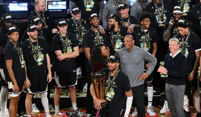 Dec 17, 2024; Las Vegas, Nevada, USA; Milwaukee Bucks forward Giannis Antetokounmpo (34) celebrates with the trophy, other players and staff after winning the Emirates NBA Cup championship game against the Oklahoma City Thunder at T-Mobile Arena. Mandatory Credit: Candice Ward-Imagn Images