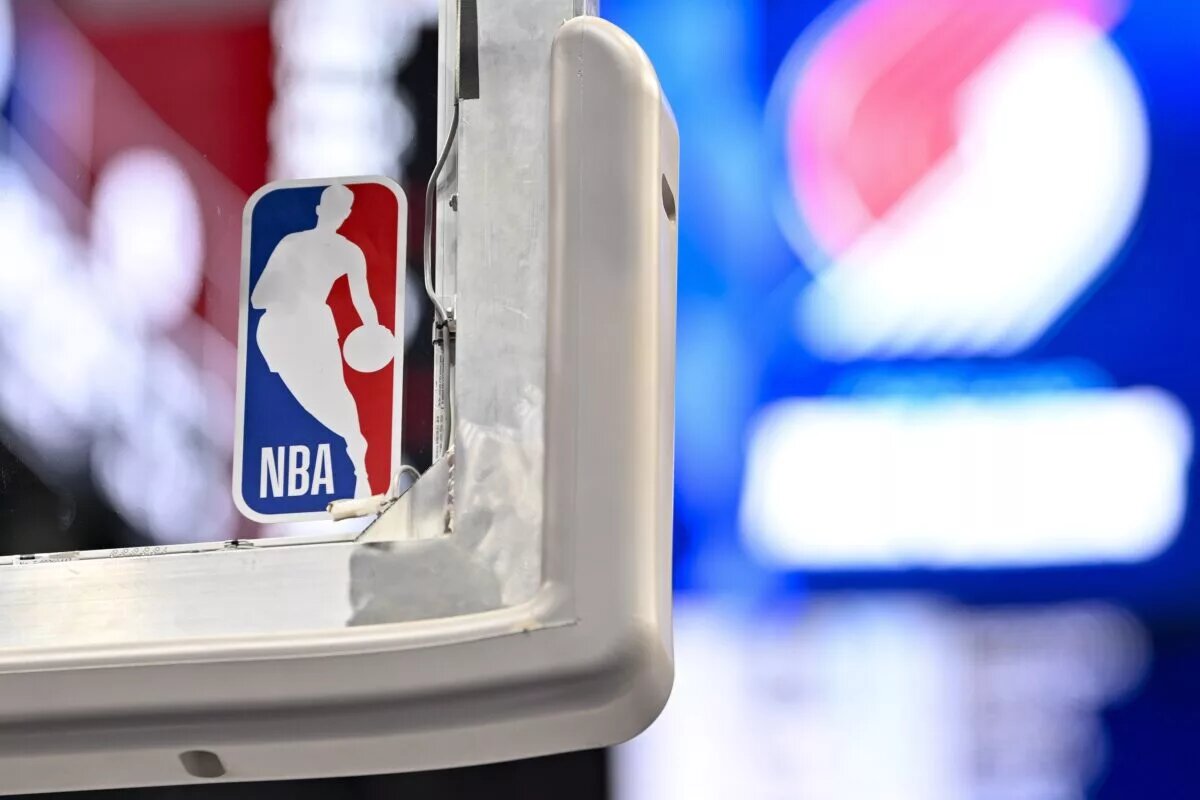 A view of the NBA Logo, juxtaposed with European soccer