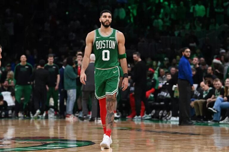 Dec 25, 2024; Boston, Massachusetts, USA; Boston Celtics forward Jayson Tatum (0) walks on the court during a timeout during the second half against the Philadelphia 76ers at TD Garden. Mandatory Credit: Eric Canha-Imagn Images