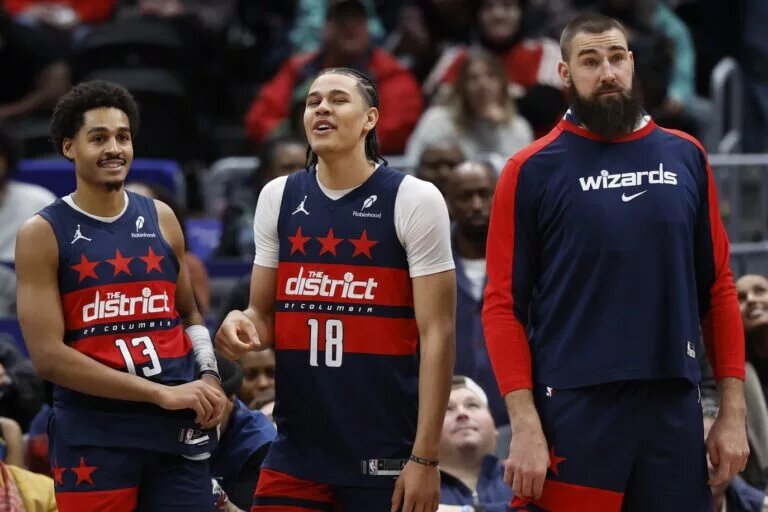 Washington Wizards guard Jordan Poole, forward Kyshawn George and Jonas Valanciunas
