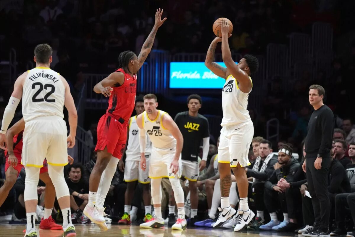 Utah Jazz forward Brice Sensabaugh (28) shoots over Miami Heat guard Josh Christopher (8)