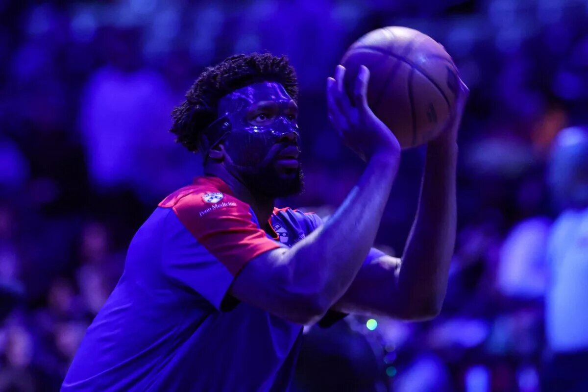 Philadelphia 76ers center Joel Embiid (21) warms up before the game