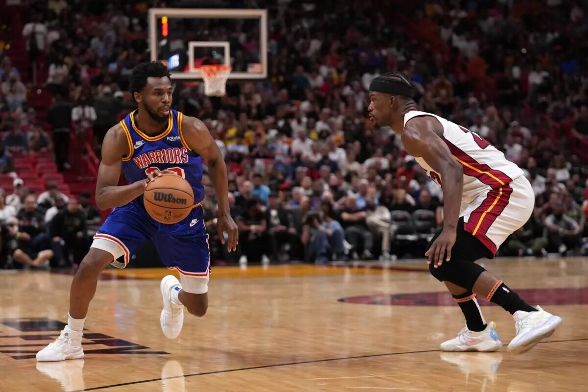 Miami Heat forward Jimmy Butler guards Golden State Warriors wing Andrew Wiggins (Wiggins is currently a Toronto Raptors trade candidate)