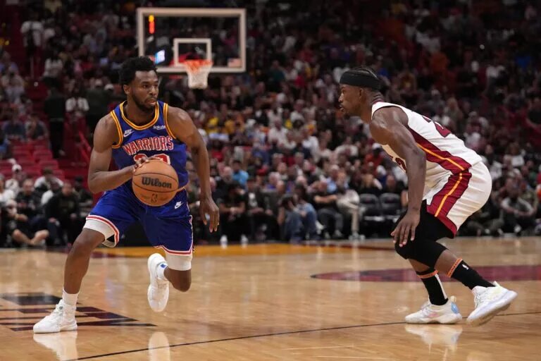 Miami Heat forward Jimmy Butler guards Golden State Warriors wing Andrew Wiggins (Wiggins is currently a Toronto Raptors trade candidate)