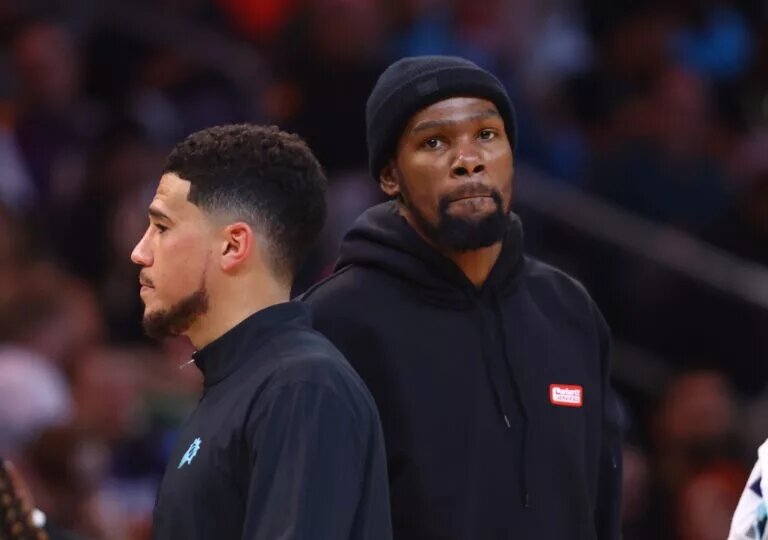 Feb 24, 2023; Phoenix, Arizona, USA; Phoenix Suns forward Kevin Durant (right) and guard Devin Booker against the Oklahoma City Thunder in the first half at Footprint Center. Mandatory Credit: Mark J. Rebilas-USA TODAY Sports