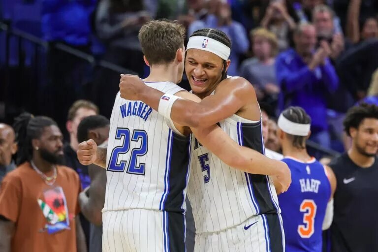 Dec 29, 2023; Orlando, Florida, USA; Orlando Magic forward Franz Wagner (22) and forward Paolo Banchero (5) celebrate their 117-108 win against the New York Knicks at KIA Center. Mandatory Credit: Mike Watters-USA TODAY Sports