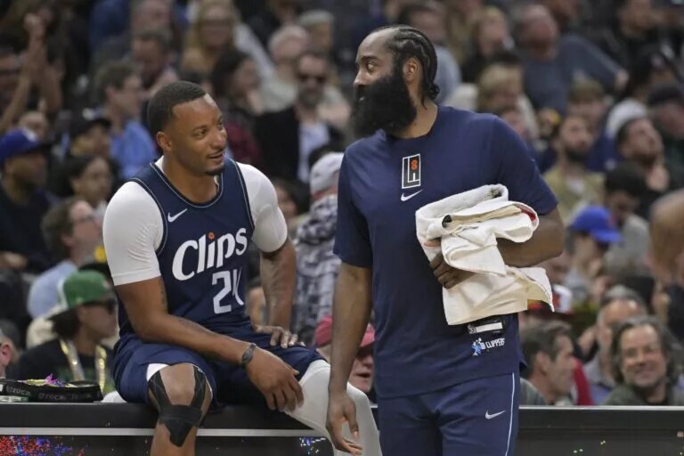 Los Angeles Clippers guard Norman Powell (24) talks with guard James Harden