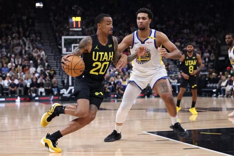 Golden State Warriors big man Trayce Jackson-Davis guards Utah Jazz big man John Collins