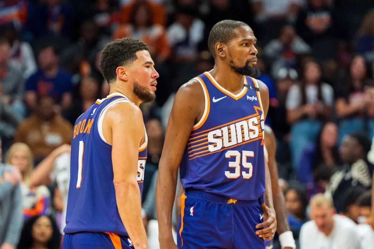 Nov 2, 2024; Phoenix, Arizona, USA; Phoenix Suns guard Devin Booker (1) and forward Kevin Durant (35) react after a time out late in the second half during a game against the Portland Trail Blazers at Footprint Center. Mandatory Credit: Allan Henry-Imagn Images