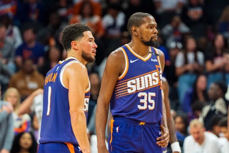 Nov 2, 2024; Phoenix, Arizona, USA; Phoenix Suns guard Devin Booker (1) and forward Kevin Durant (35) react after a time out late in the second half during a game against the Portland Trail Blazers at Footprint Center. Mandatory Credit: Allan Henry-Imagn Images