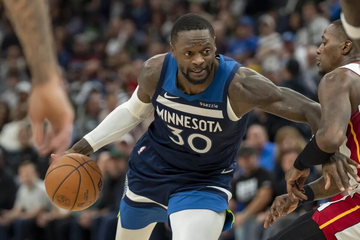 Minnesota Timberwolves forward Julius Randle guarded by Miami Heat players