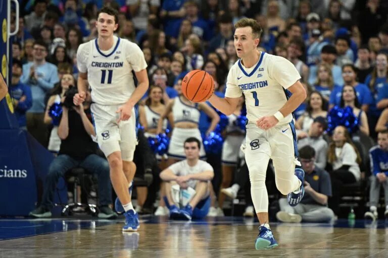 Creighton Bluejays guard Steven Ashworth (1) dribbles up the court with center Ryan Kalkbrenner (11) against the UMKC Kangaroos in the second half at CHI Health Center Omaha.
