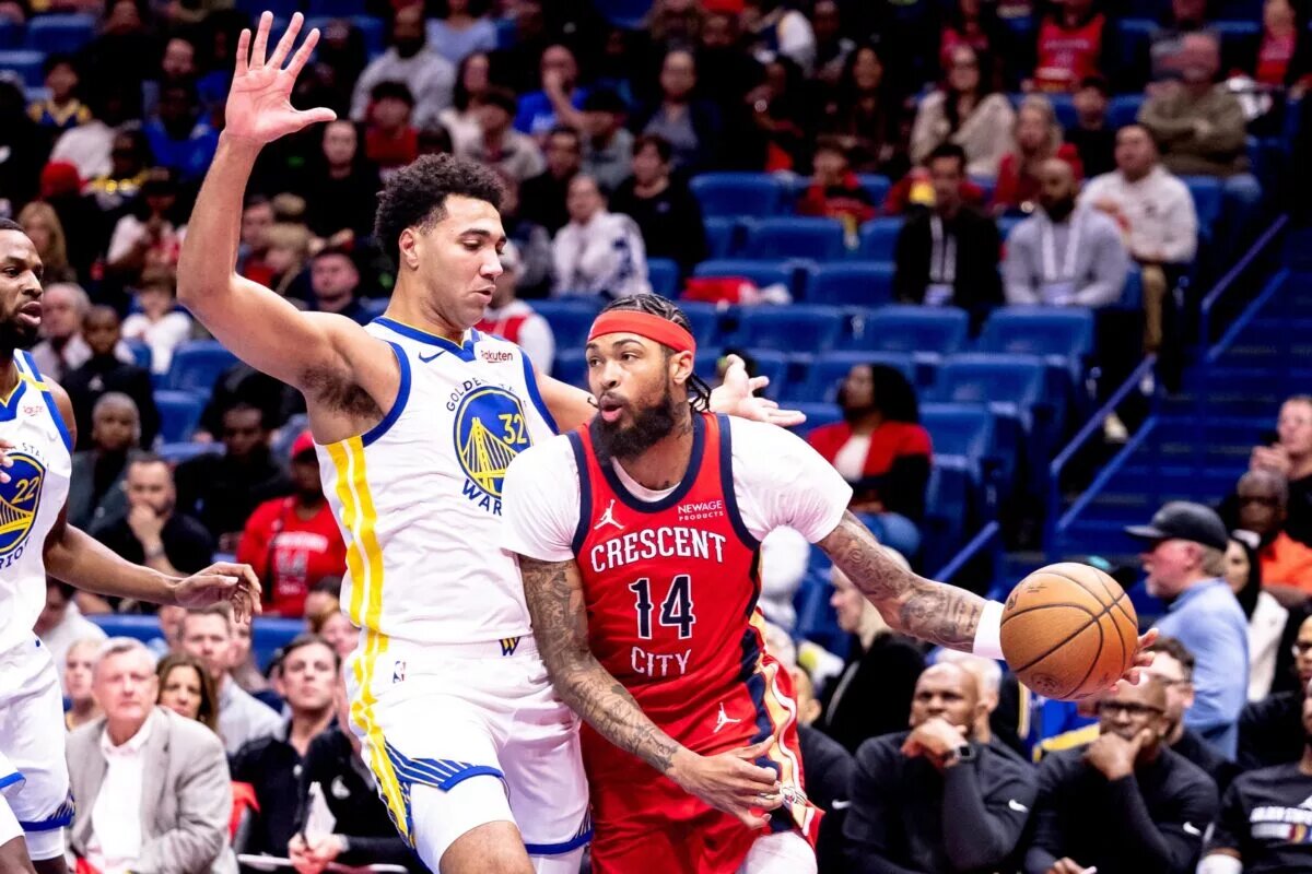 Nov 22, 2024; New Orleans, Louisiana, USA; New Orleans Pelicans forward Brandon Ingram (14) dribbles against Golden State Warriors forward Trayce Jackson-Davis (32) during first half at Smoothie King Center. Mandatory Credit: Stephen Lew-Imagn Images