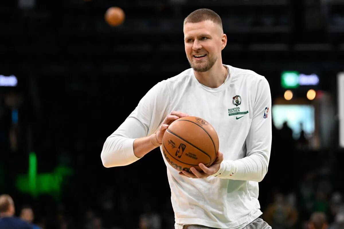 Nov 24, 2024; Boston, Massachusetts, USA; Boston Celtics center Kristaps Porzingis (8) warms up before a game against the Minnesota Timberwolves at TD Garden. Mandatory Credit: Eric Canha-Imagn Images
