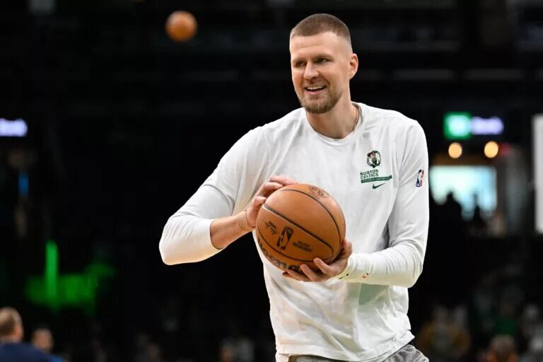 Nov 24, 2024; Boston, Massachusetts, USA; Boston Celtics center Kristaps Porzingis (8) warms up before a game against the Minnesota Timberwolves at TD Garden. Mandatory Credit: Eric Canha-Imagn Images