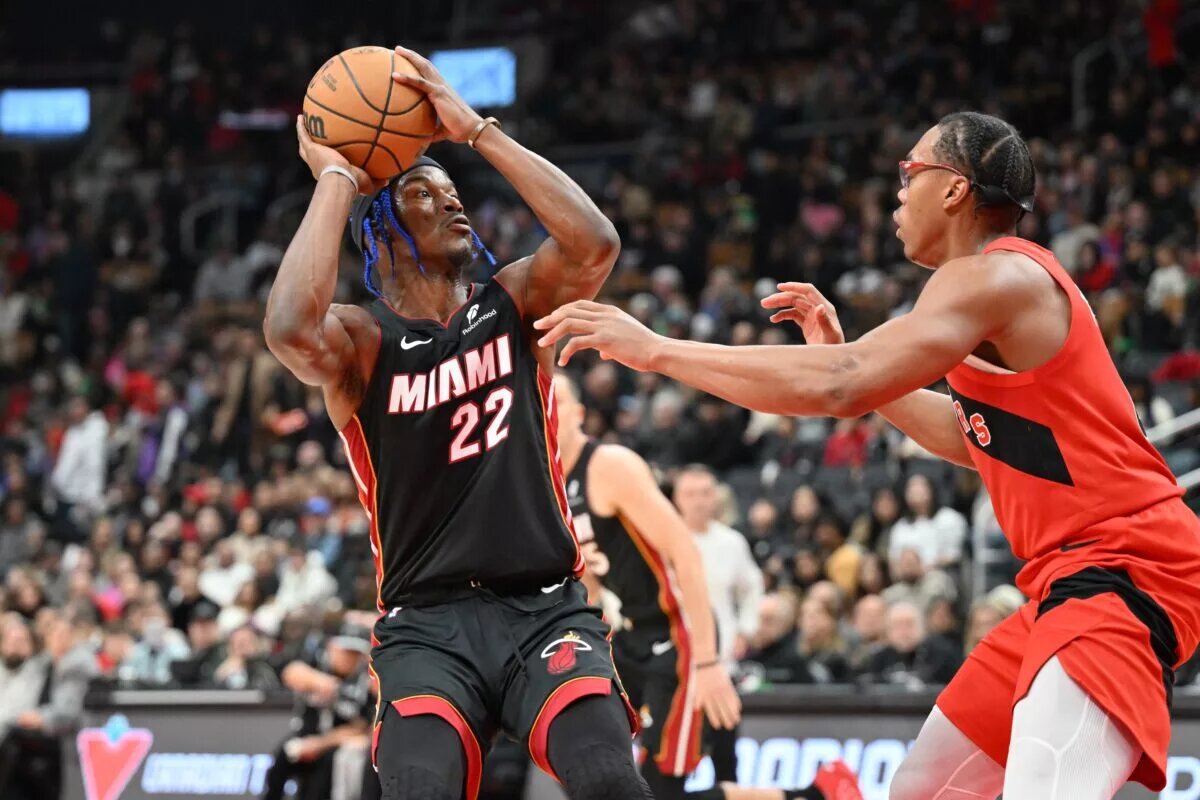 Toronto Raptors forward Scottie Barnes defends against Miami Heat forward Jimmy Butler
