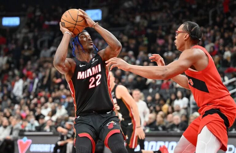 Toronto Raptors forward Scottie Barnes defends against Miami Heat forward Jimmy Butler
